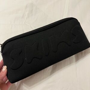 Skims Black Pouch